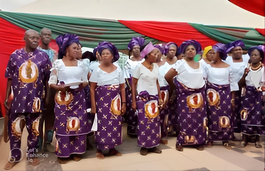 Nkata Ndi Inyom Igbo community in traditional purple and gold attire